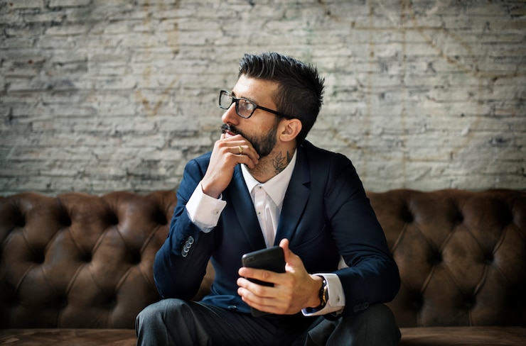 Free Photo a businessman using a smartphone