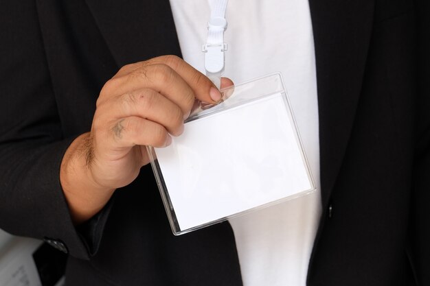 businessman with business concept holding white card