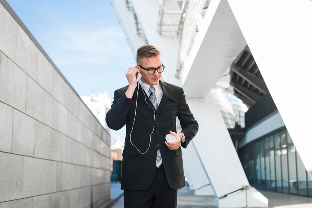 Businessman with earphones