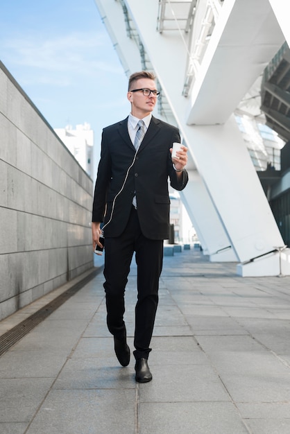 Businessman with earphones