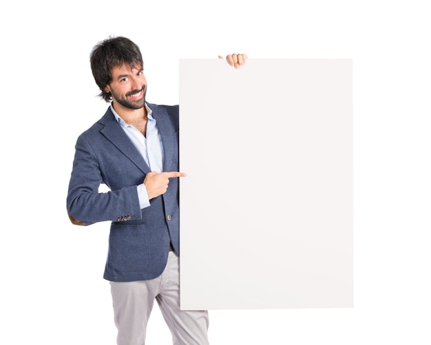 Businessman with empty placard over idolated white background