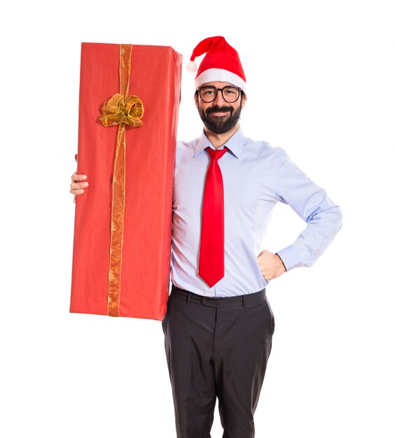 Businessman with gift over white