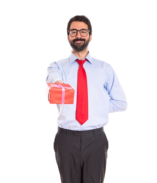 Businessman with gift over white