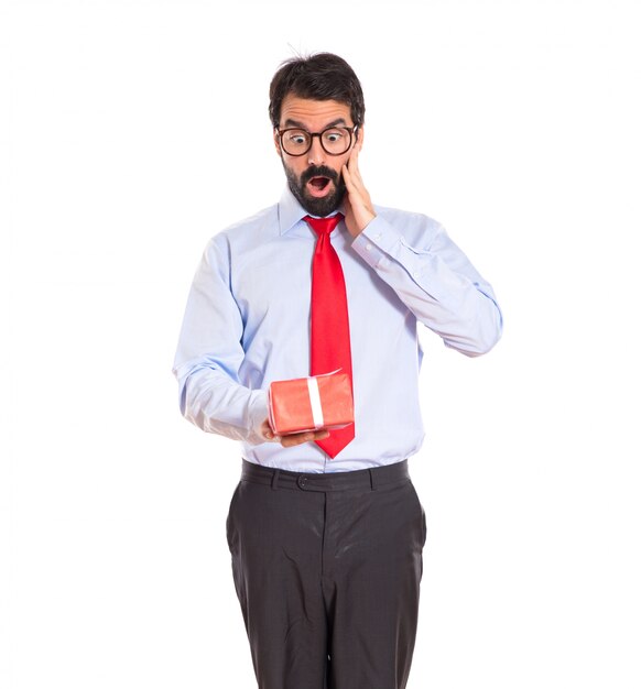 Businessman with gift over white