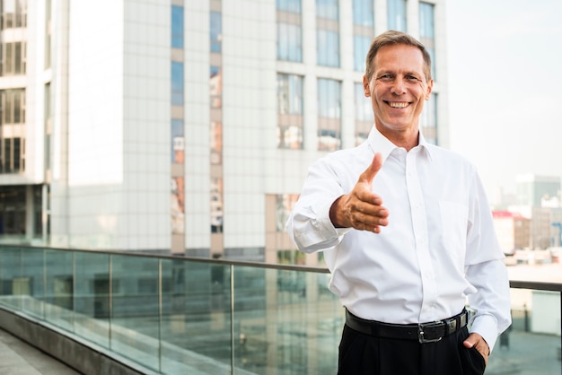 Businessman with hand reaching out