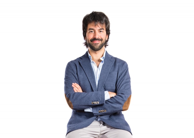 Businessman with his arms crossed over white background