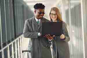 Free photo businessman with his partner working in a office