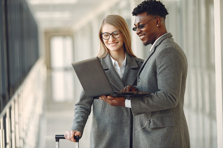 Free Photo businessman with his partner working in a office