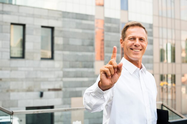 Businessman with index finger up