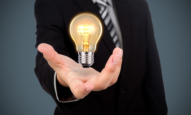 Businessman with a light bulb in his hand