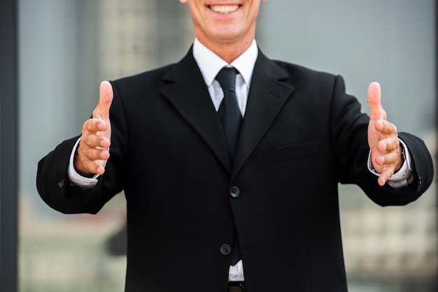 Businessman with palms facing each other