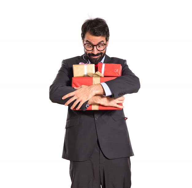 Free photo businessman with several gifts