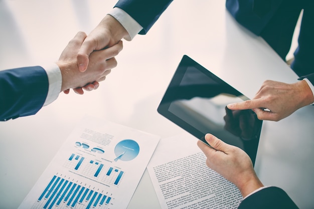 Free Photo businessman with tablet after closing a deal