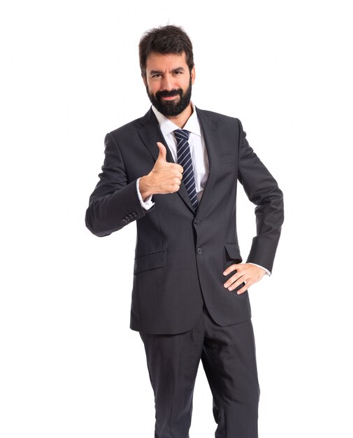 Businessman with thumb up over white background