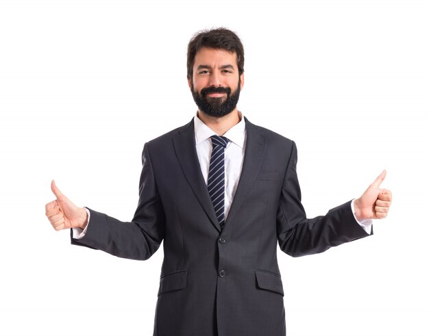 Businessman with thumb up over white background