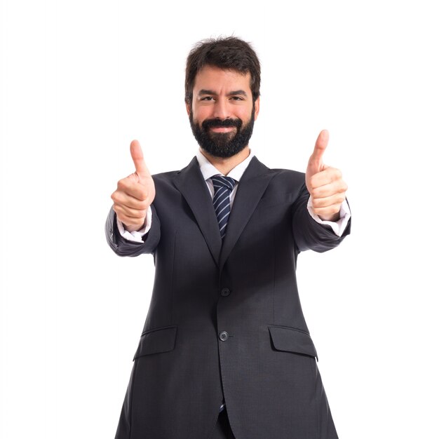 Businessman with thumb up over white background