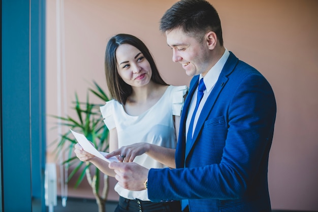 Businessman and woman with a document