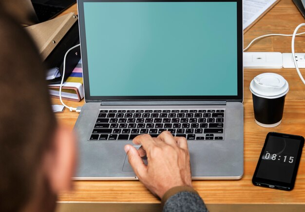 Businessman working on a laptop a during meeting