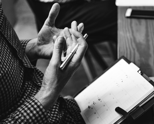 Free Photo | Businessman writing in a calendar