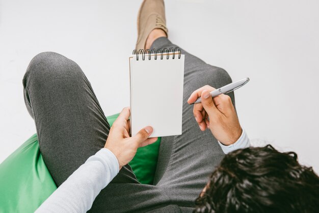 Businessman writing on his notebook