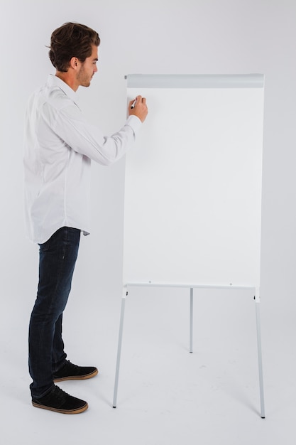 Businessman writing on whiteboard