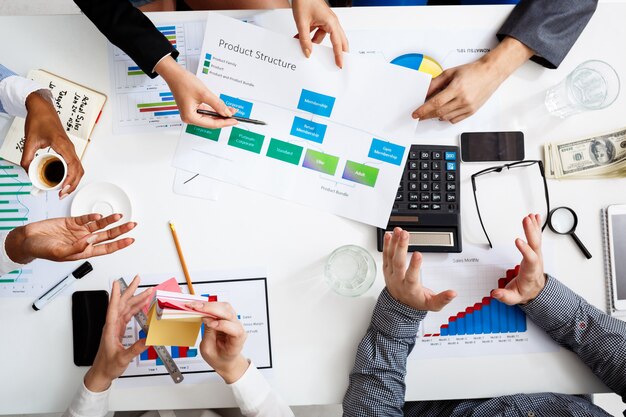  businessmen hands on white table with documents and drafts