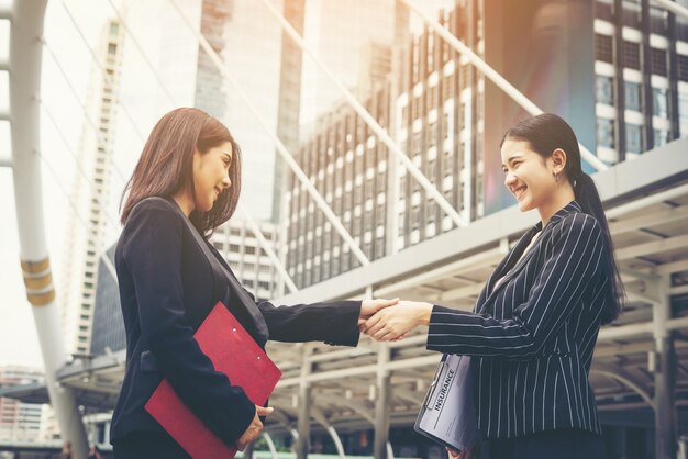 Free Photo businessmen handshake with workmate,handshake business partner work deal together.