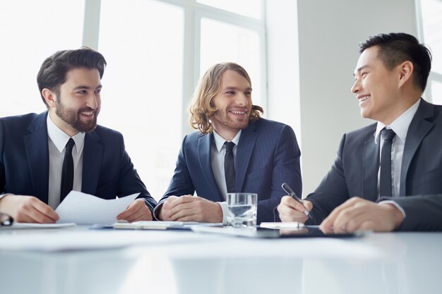 Businessmen joking at the meeting