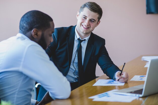 Businessmen in office scene