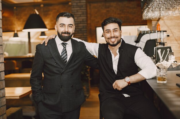 Businessmen posing at the cafe