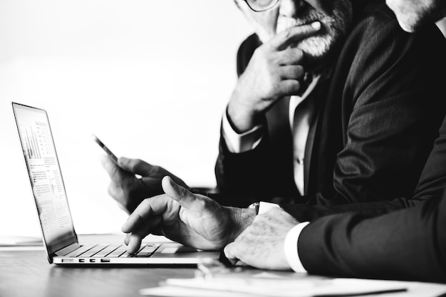 Businessmen using computer laptop