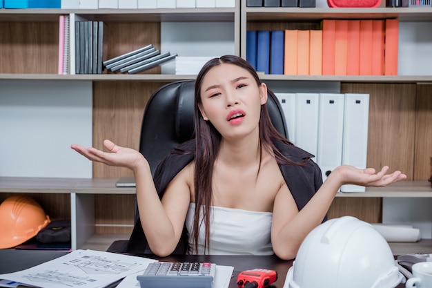 Free photo businessmen, women working in the office with stress and fatigue.