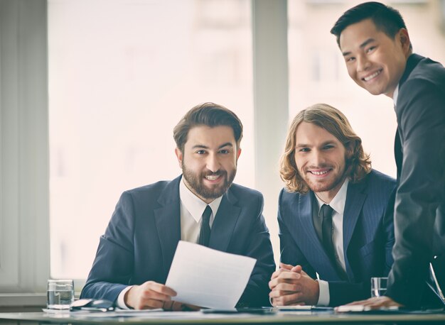 Businessmen working with window background