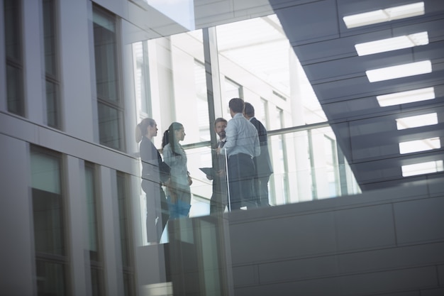 Businesspeople interacting inside office building