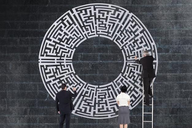 Businesspeople solving a labyrinth