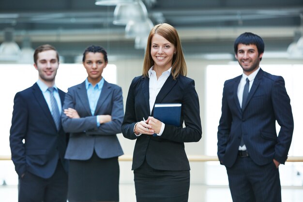 Businesspeople standing together in office