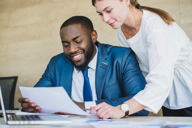 Businesspersons checking document