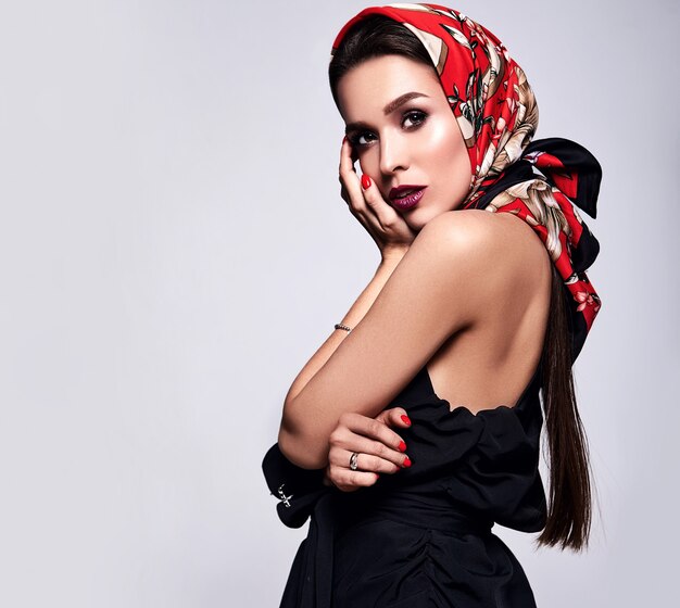 businesswoman in black dress with evening makeup and colorful lips in red shawl