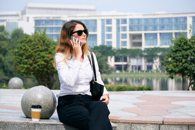 Businesswoman calling on phone