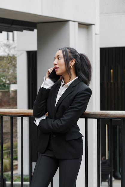 Businesswoman calling with her smartphone