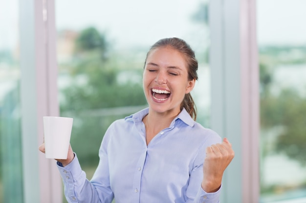 Businesswoman Celebrating in Office 1