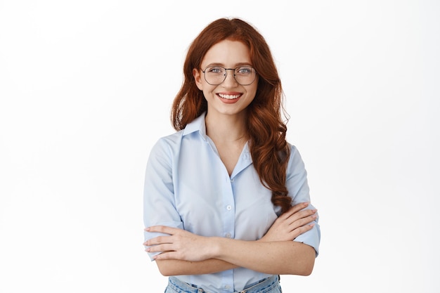 businesswoman in eyeglasses posing on white