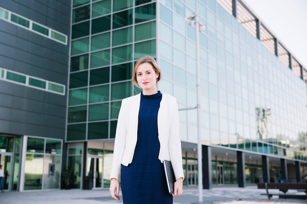 Businesswoman in front of modern building