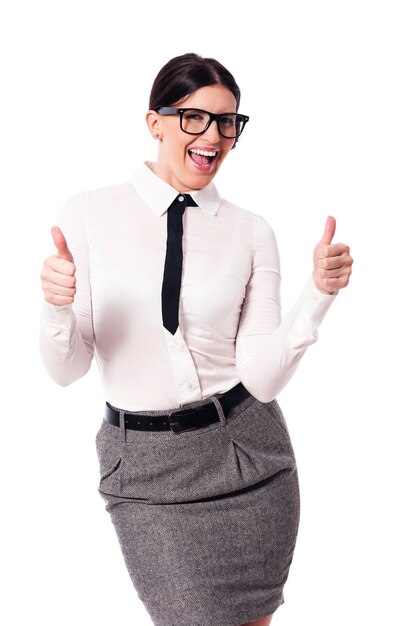 Businesswoman gesturing thumbs up