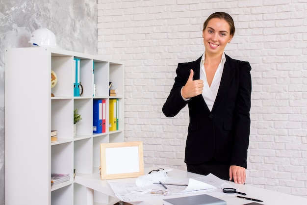 Businesswoman giving a thumbs up 