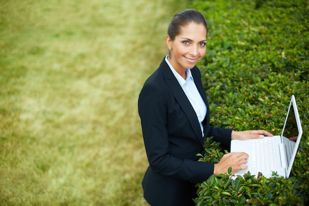 Businesswoman on green grass