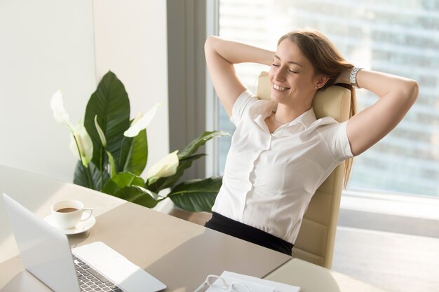 Businesswoman having positive feelings about work