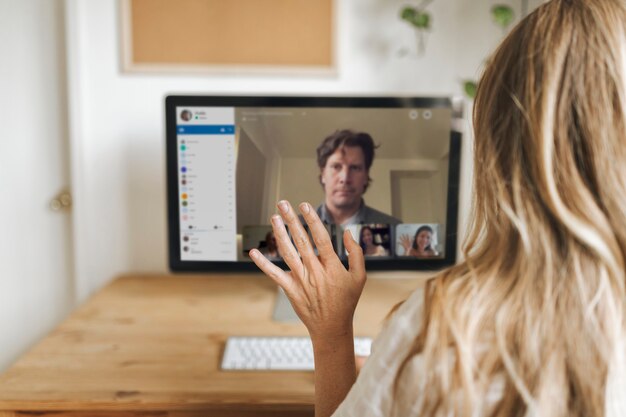 Businesswoman having a video conference with colleagues during coronavirus quarantine