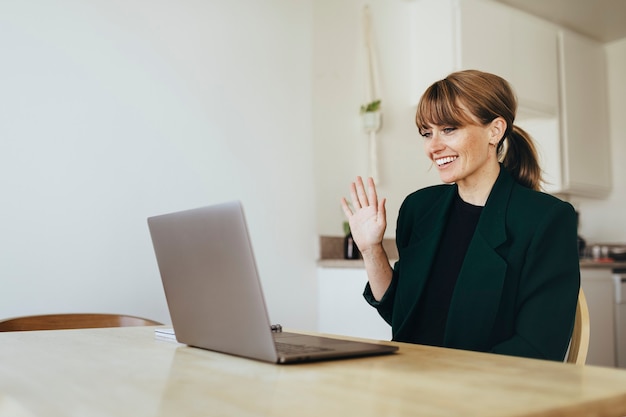 Businesswoman having a video conference with colleagues during coronavirus quarantine