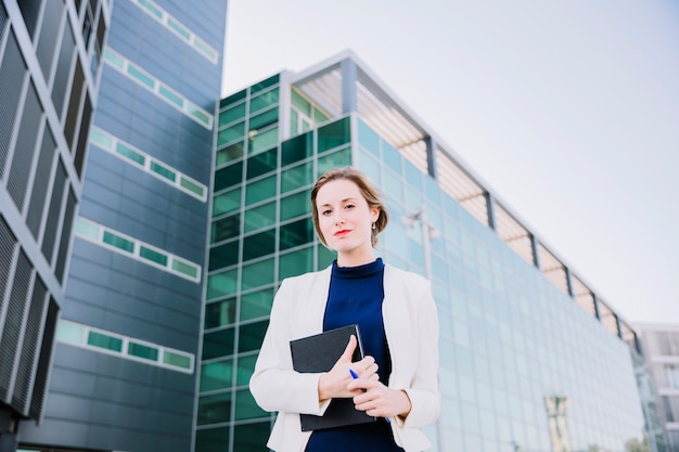 Businesswoman holding book